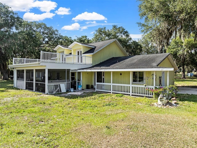 exterior space featuring a front yard and a sunroom