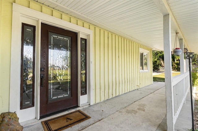 doorway to property with covered porch