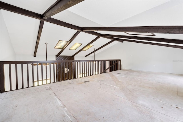 additional living space featuring lofted ceiling