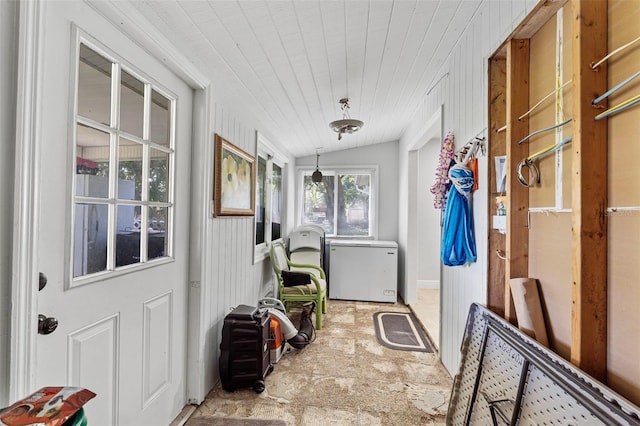 sunroom featuring lofted ceiling