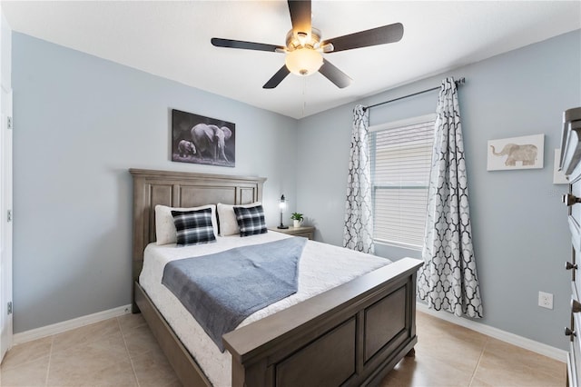 bedroom with ceiling fan and light tile patterned floors