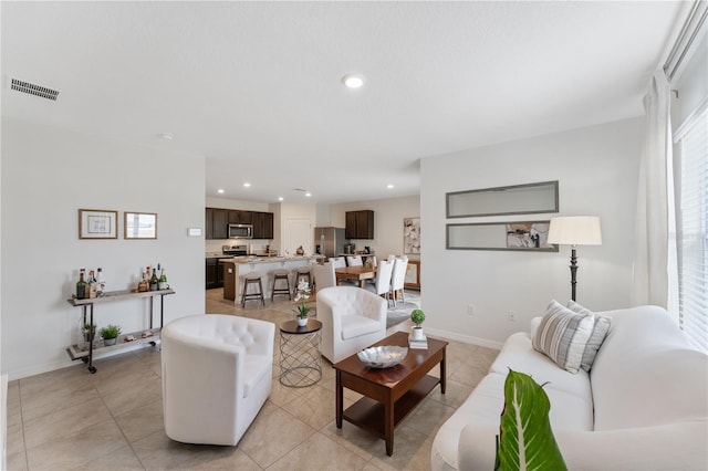 living room featuring light tile patterned floors