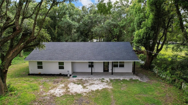 view of front of property with a front lawn and a patio