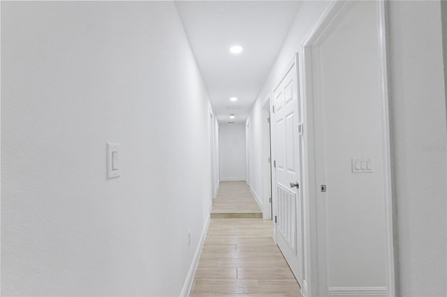 corridor featuring light hardwood / wood-style floors