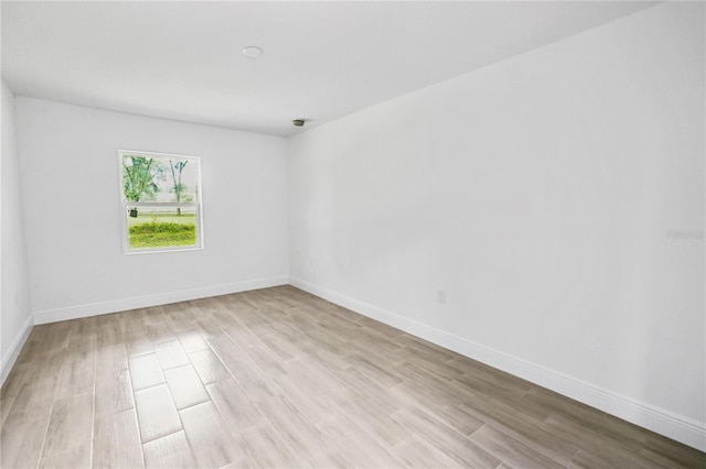 unfurnished room with light hardwood / wood-style flooring