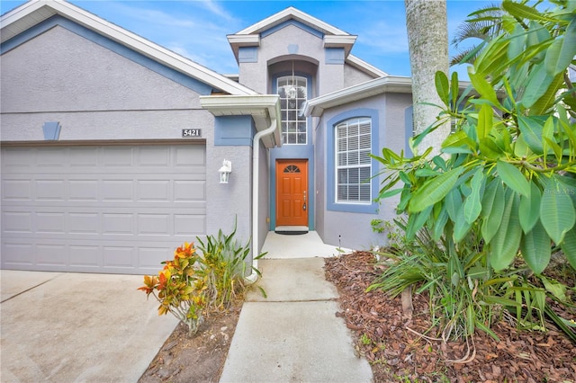 entrance to property featuring a garage