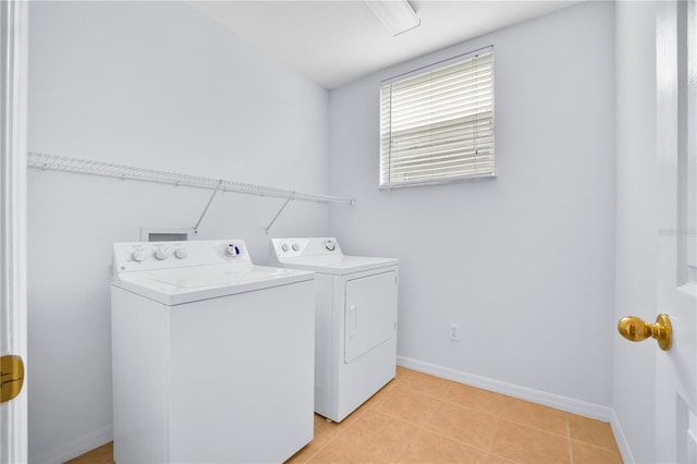 washroom with washer and dryer