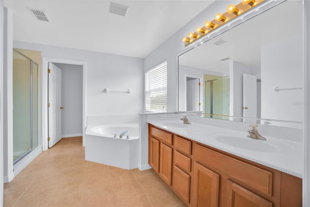 bathroom featuring separate shower and tub, vanity, and tile patterned floors