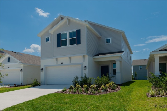 view of front facade with a garage and a front lawn