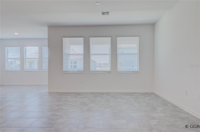 empty room featuring light tile patterned floors