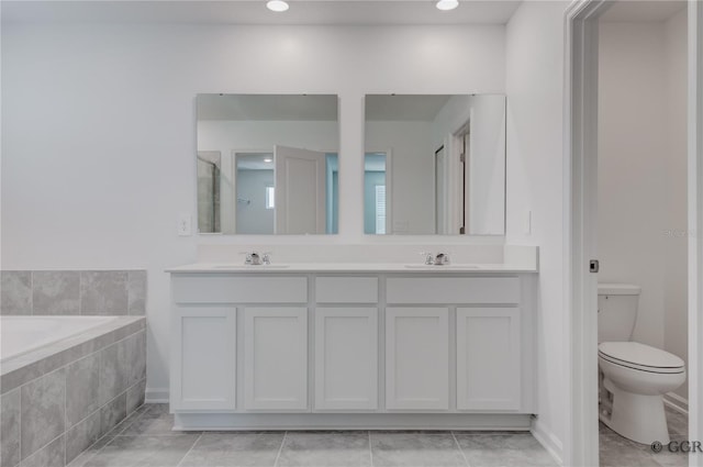 full bathroom with shower with separate bathtub, tile patterned floors, vanity, and toilet