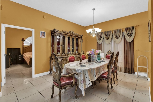 tiled dining area with a notable chandelier