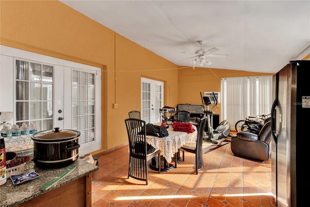 dining room with lofted ceiling, ceiling fan, french doors, and a wealth of natural light