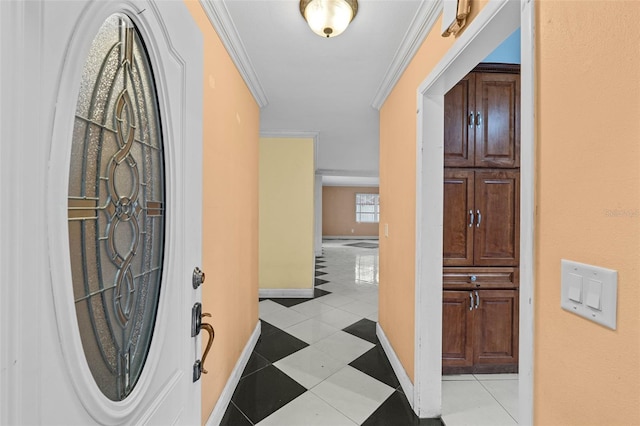 tiled entrance foyer featuring ornamental molding