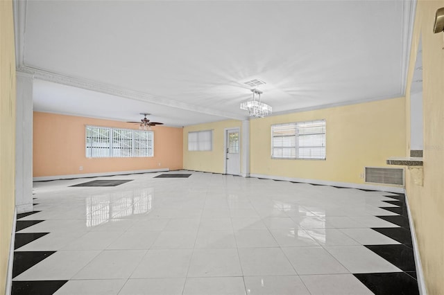 spare room featuring ceiling fan with notable chandelier, a healthy amount of sunlight, ornamental molding, and light tile patterned floors