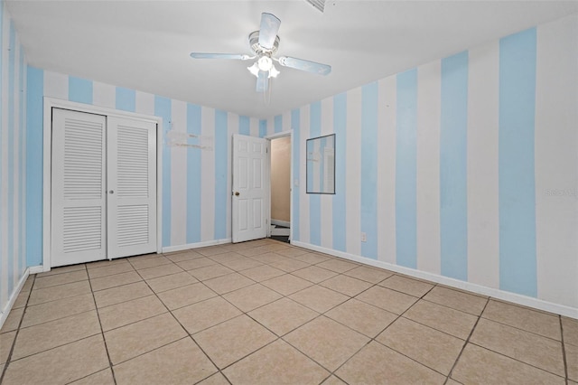 unfurnished bedroom with ceiling fan and light tile patterned floors