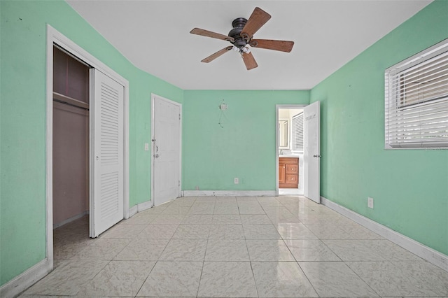 unfurnished bedroom featuring ceiling fan and light tile patterned floors