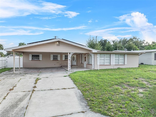 ranch-style house featuring a front lawn