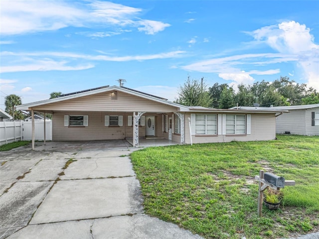 single story home featuring a front lawn