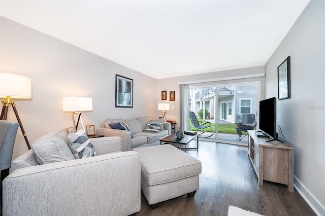 living room with dark hardwood / wood-style floors