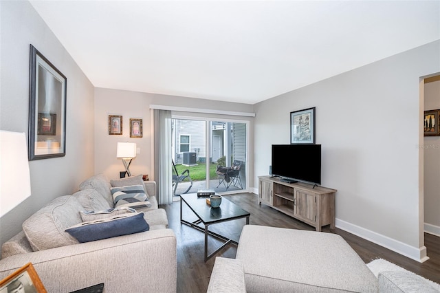 living room featuring dark wood-type flooring