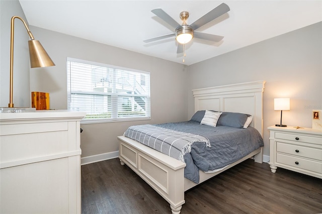 bedroom with ceiling fan and dark wood-type flooring