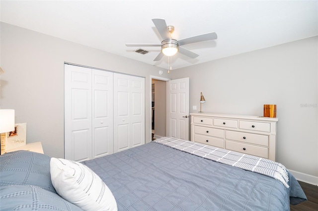 bedroom featuring a closet, ceiling fan, and hardwood / wood-style floors