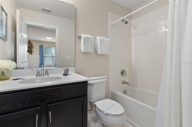 full bathroom with shower / bath combo with shower curtain, vanity, and toilet