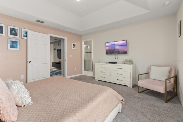 carpeted bedroom with ensuite bath