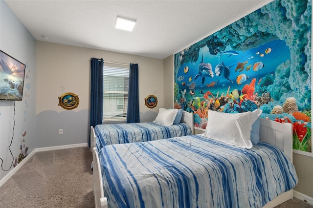 bedroom with carpet floors and a textured ceiling