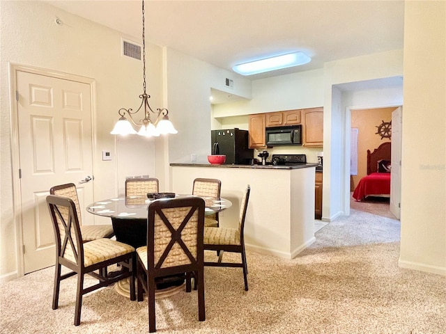 carpeted dining area featuring a notable chandelier