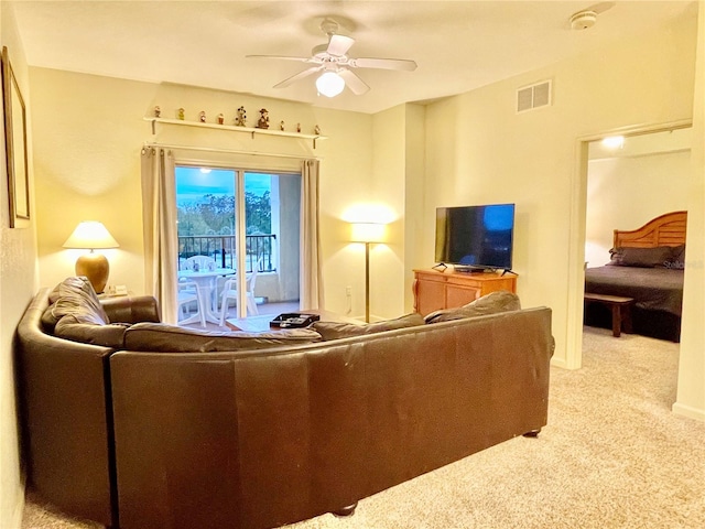 living room with light carpet and ceiling fan