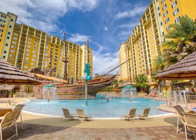 view of swimming pool featuring pool water feature