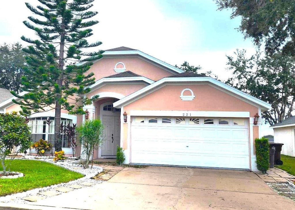 single story home featuring a garage