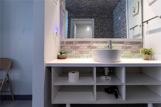 bathroom with backsplash and a sink