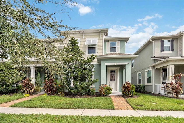 view of front of home with a front lawn