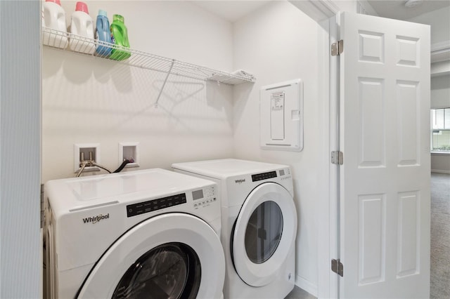 washroom featuring washing machine and dryer and carpet flooring