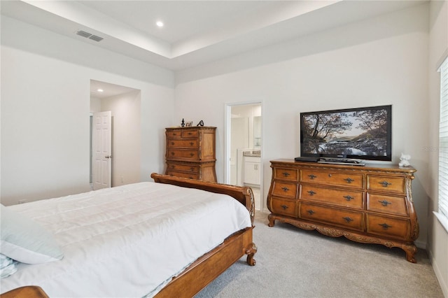 carpeted bedroom featuring ensuite bathroom