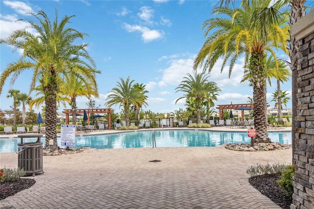 view of pool featuring a pergola and a patio area