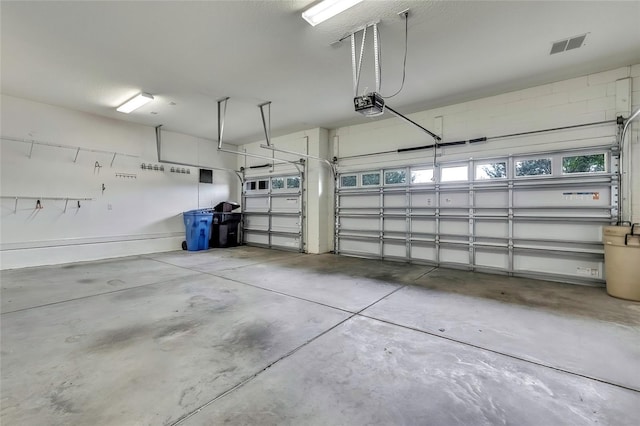 garage featuring a garage door opener