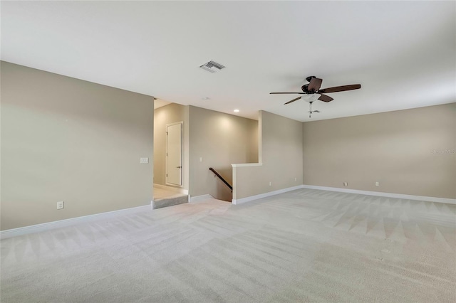 empty room featuring light carpet and ceiling fan