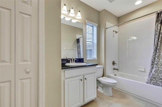 full bathroom with toilet, vanity, tile patterned floors, and shower / bath combo with shower curtain