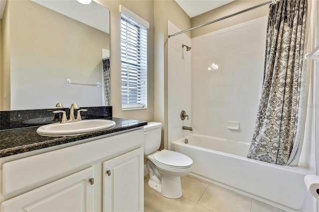 full bathroom featuring toilet, vanity, tile patterned floors, and shower / tub combo with curtain