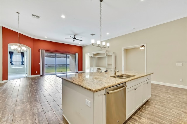 kitchen featuring dishwasher, a center island with sink, sink, hanging light fixtures, and white cabinetry