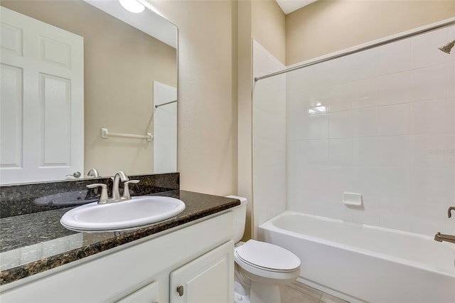 full bathroom featuring tile patterned floors, toilet, vanity, and tiled shower / bath