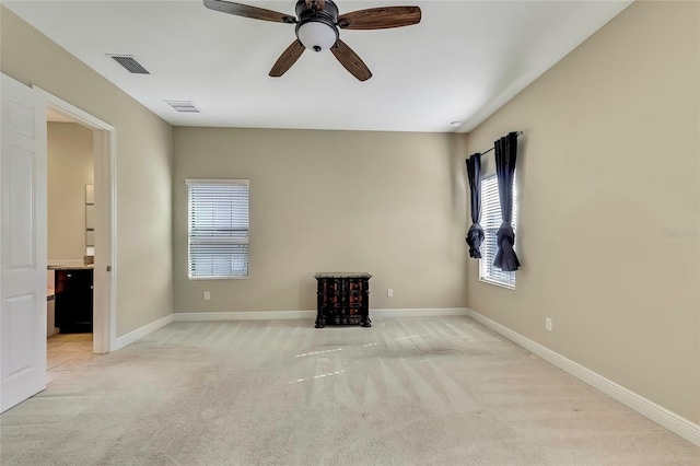 carpeted empty room with ceiling fan