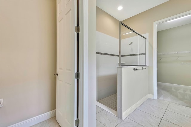 bathroom with tiled shower