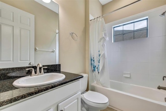 full bathroom with vanity, toilet, and shower / tub combo with curtain