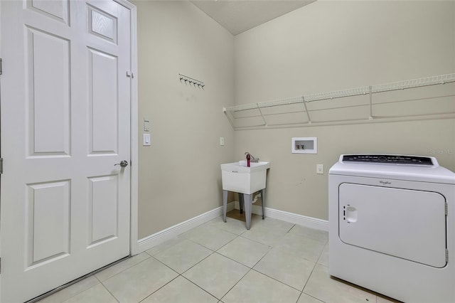 washroom featuring separate washer and dryer and light tile patterned floors