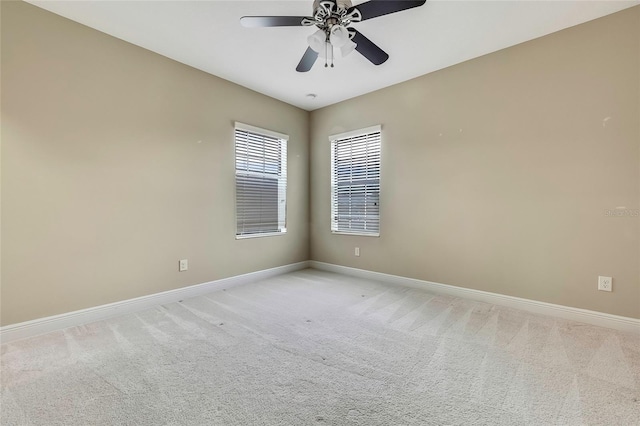 carpeted empty room with ceiling fan